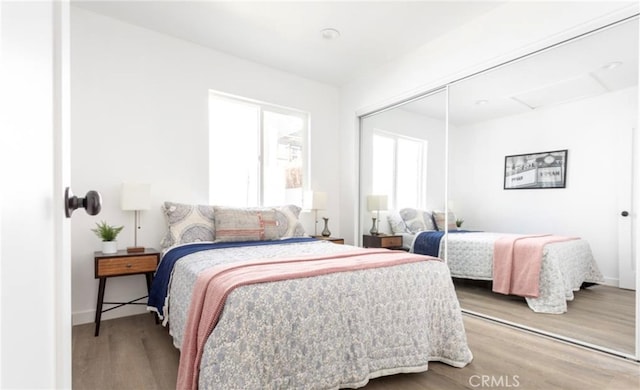 bedroom featuring a closet and hardwood / wood-style flooring