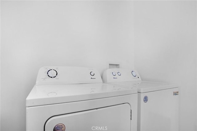 washroom with separate washer and dryer