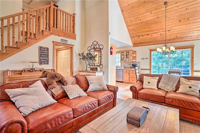 living room with high vaulted ceiling, an inviting chandelier, and wooden ceiling