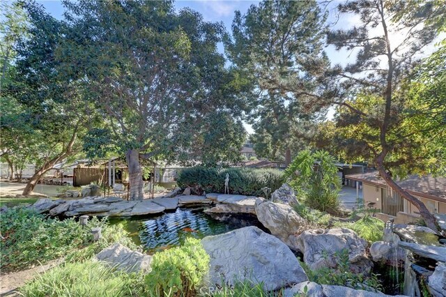 view of yard with a small pond