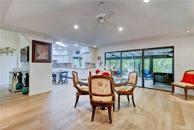 dining room featuring ceiling fan, a healthy amount of sunlight, and light wood-type flooring