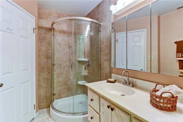 bathroom with vanity and an enclosed shower