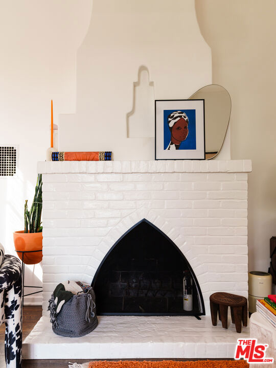 room details with a fireplace and hardwood / wood-style floors