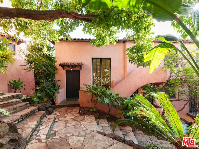 entrance to property with a patio area