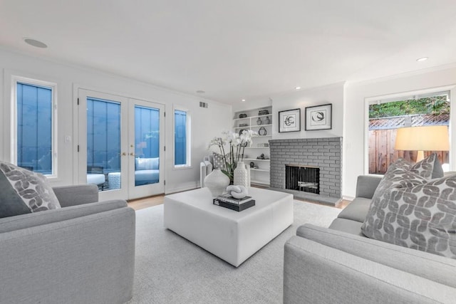 living room featuring a fireplace and french doors