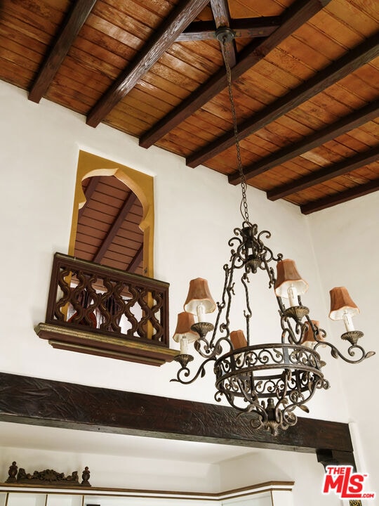 details featuring beamed ceiling and wooden ceiling