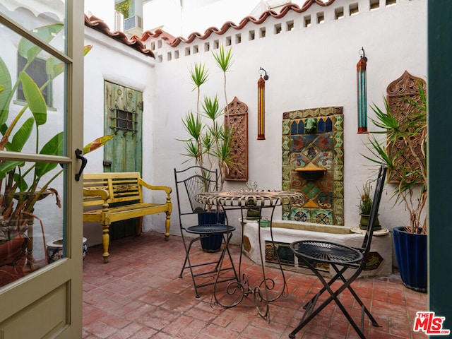 view of patio / terrace featuring a fireplace