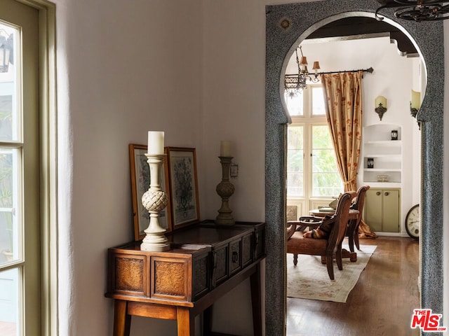 sitting room with wood-type flooring