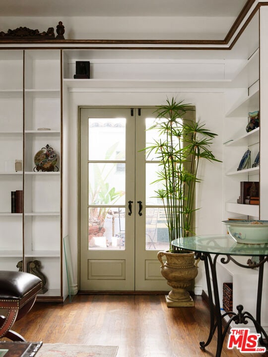 doorway to outside featuring french doors and light hardwood / wood-style floors