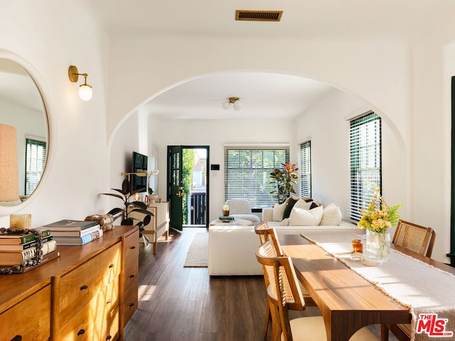 dining space featuring dark wood-type flooring