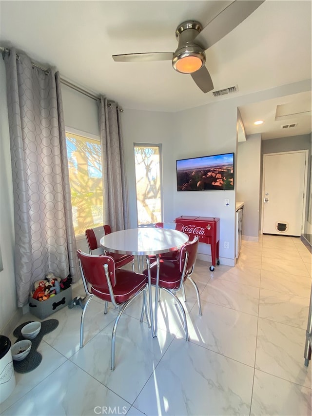 dining room featuring ceiling fan