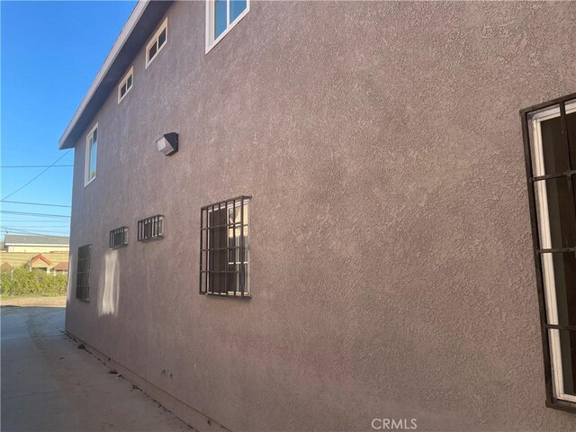 view of side of home featuring a patio area