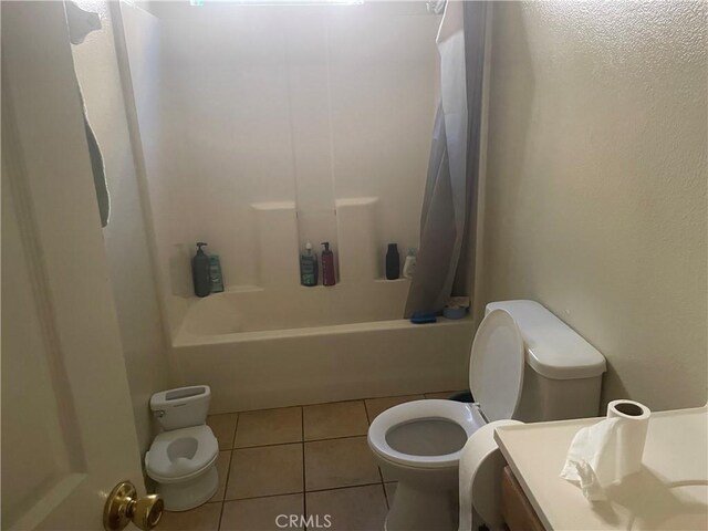 full bathroom with tile patterned floors, vanity, toilet, and shower / bathtub combination with curtain