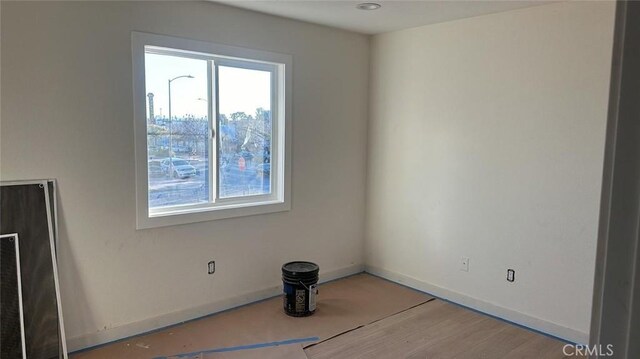 unfurnished room featuring light hardwood / wood-style flooring