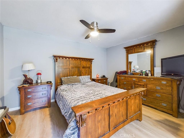 bedroom with ceiling fan and light hardwood / wood-style flooring