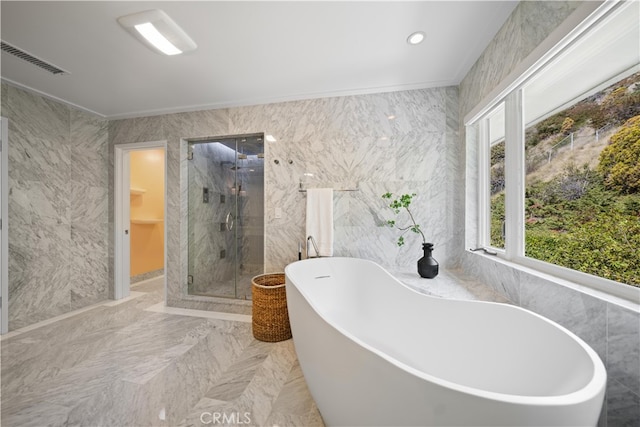 bathroom featuring independent shower and bath and tile walls