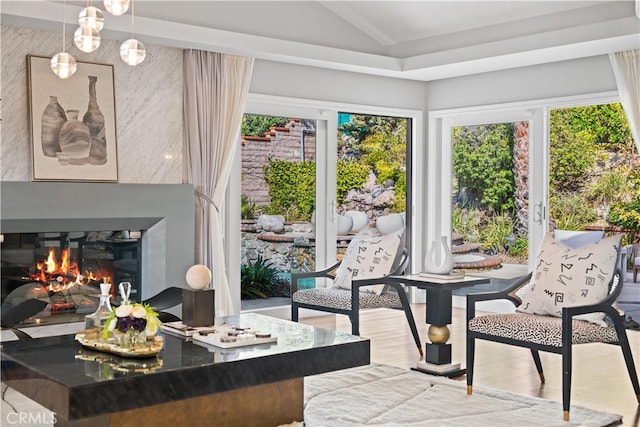 sunroom / solarium featuring lofted ceiling