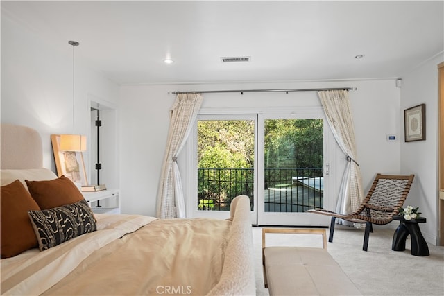 bedroom with ornamental molding, light colored carpet, and access to exterior