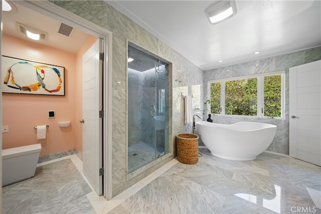 bathroom featuring plus walk in shower and toilet