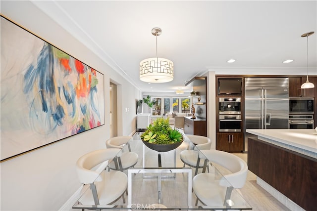 dining room featuring crown molding