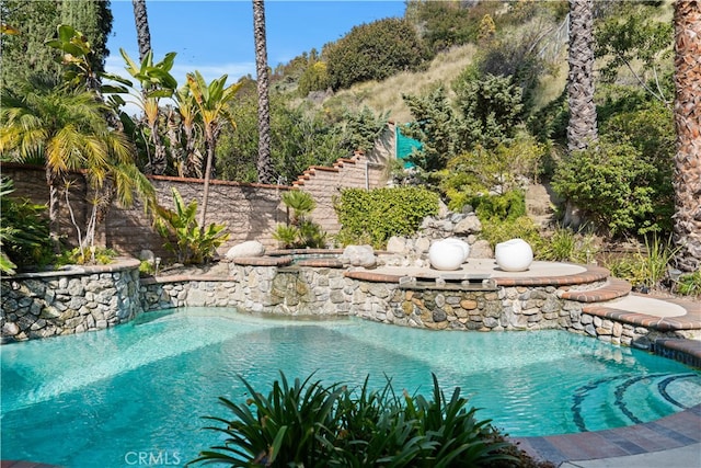 view of pool featuring pool water feature