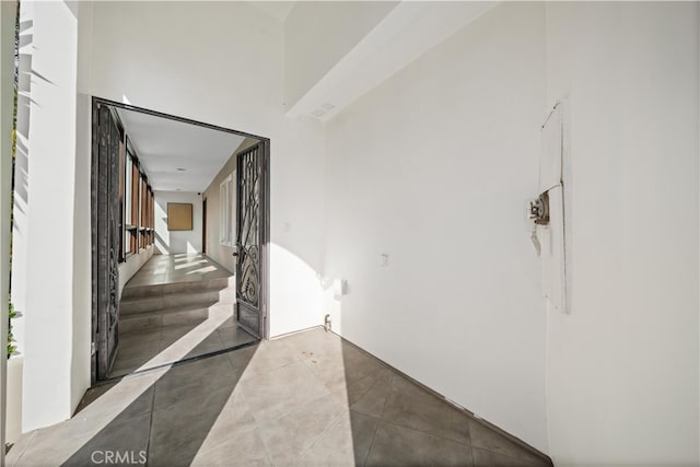 hallway featuring tile patterned floors