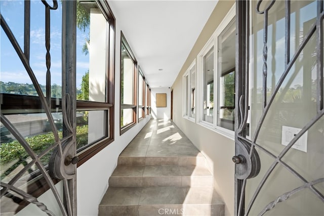 corridor featuring tile patterned flooring