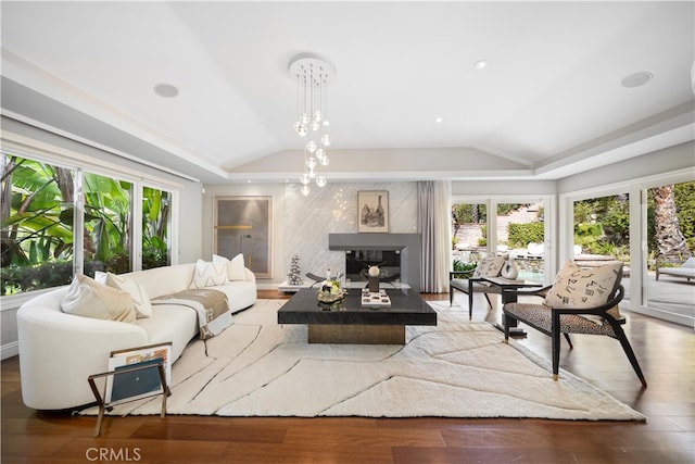 living room featuring hardwood / wood-style flooring and lofted ceiling