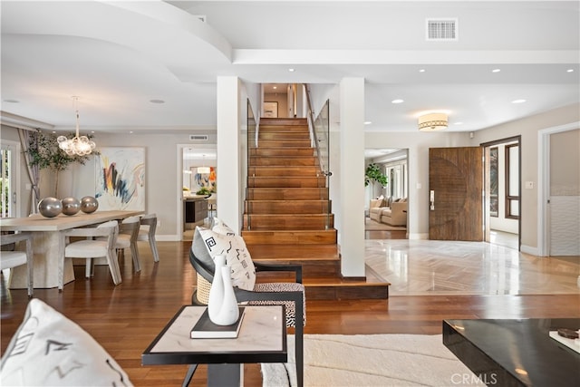 interior space featuring wood-type flooring and an inviting chandelier