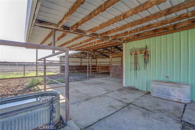 view of patio featuring an outbuilding