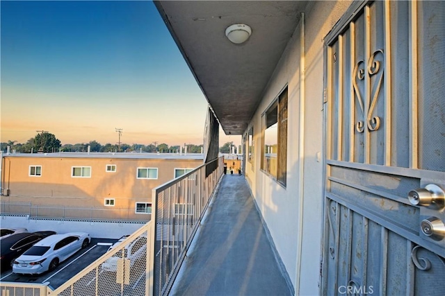 view of balcony at dusk