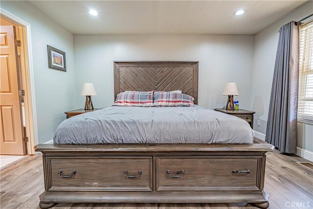 bedroom featuring light hardwood / wood-style floors