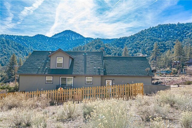 view of home's exterior with a mountain view