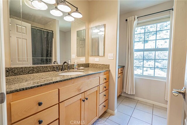 bathroom featuring tile patterned floors and vanity