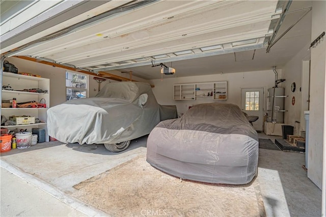 garage with secured water heater and a garage door opener