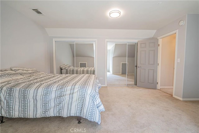 bedroom featuring carpet floors and vaulted ceiling