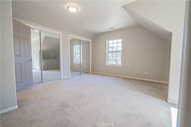 additional living space with light carpet and lofted ceiling