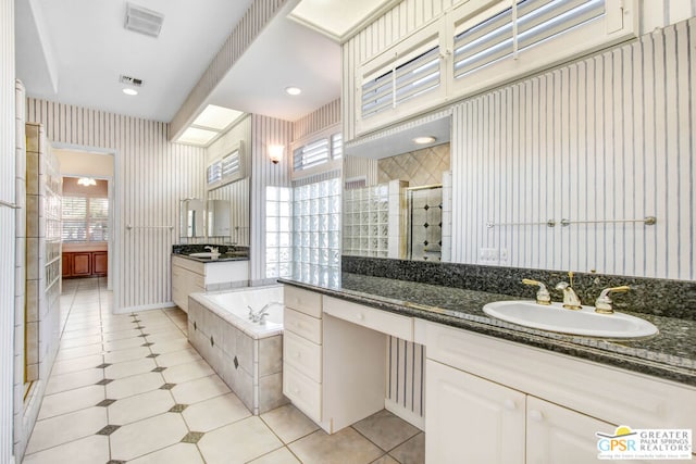 bathroom with vanity and plus walk in shower