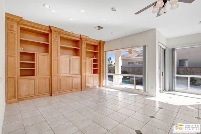 unfurnished living room with light tile patterned floors and ceiling fan