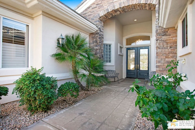 entrance to property featuring french doors