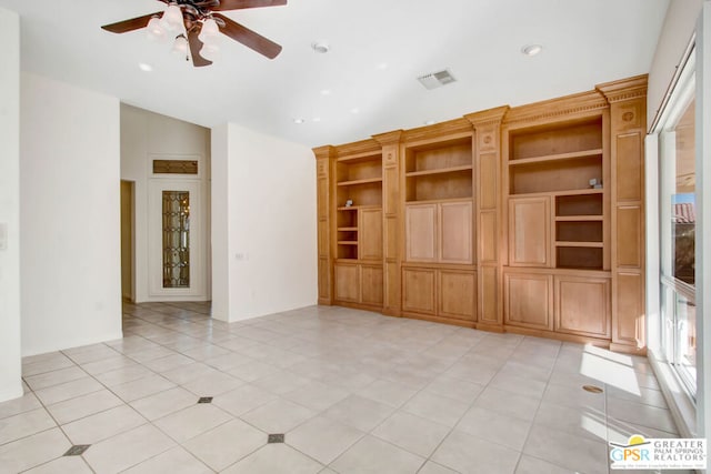 unfurnished living room with vaulted ceiling, light tile patterned floors, and ceiling fan