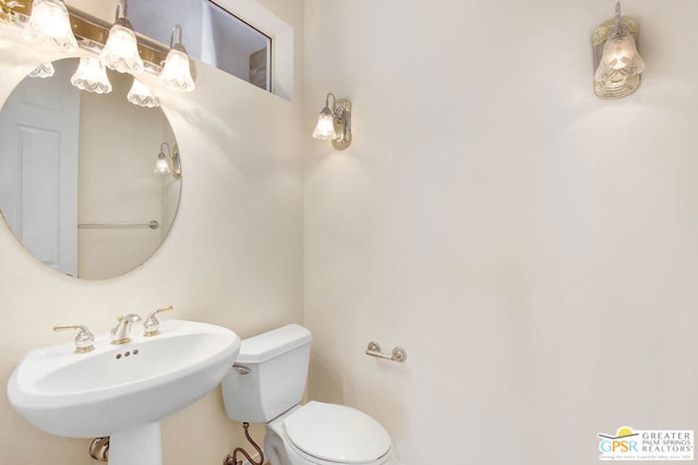 bathroom featuring sink and toilet