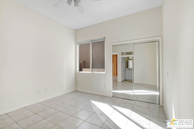 washroom featuring sink, washer and dryer, cabinets, and light tile patterned floors