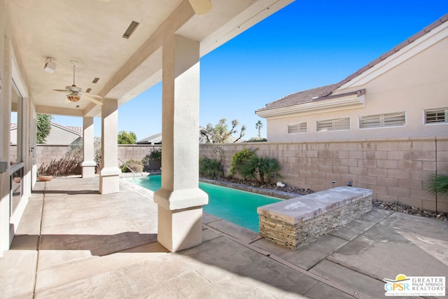 view of pool with a patio area and ceiling fan