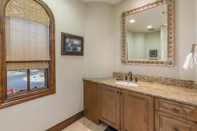 bathroom with vanity and tile patterned floors