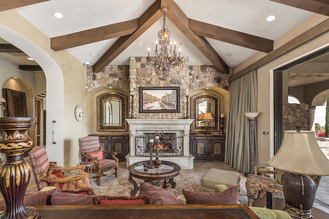 living room featuring beam ceiling, a notable chandelier, and a fireplace