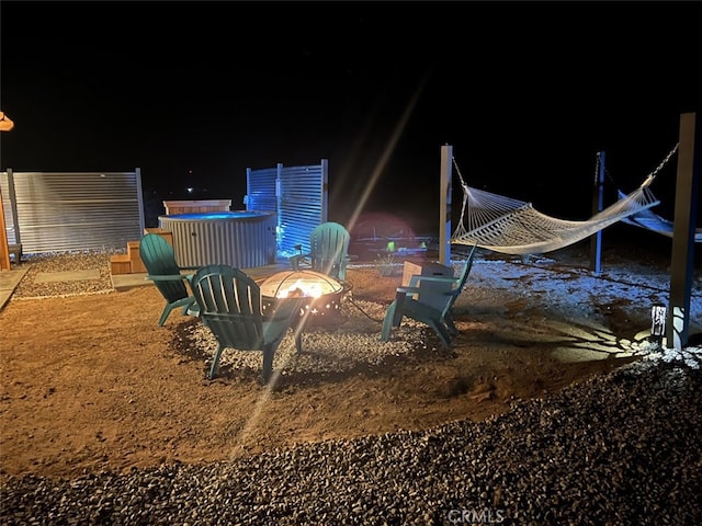 yard at twilight with an outdoor fire pit