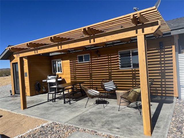 view of patio / terrace with grilling area and a pergola