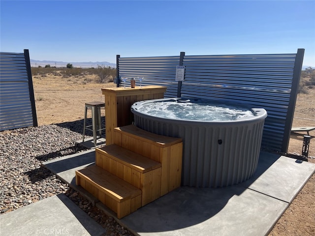 view of patio / terrace featuring a hot tub