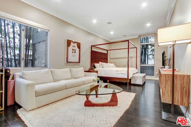 bedroom with dark wood-type flooring and crown molding